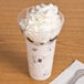 A WNA Comet Classic Crystal parfait cup filled with ice cream and whipped cream.