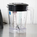 A Waring blender with a clear blender jar on a counter.