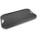 A Lodge rectangular black cast iron grill pan with handles.
