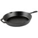 A Lodge black cast iron skillet with a helper handle.