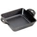 A black square cast iron casserole dish with two handles.
