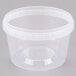 A 16 oz. clear plastic container with a white lid.