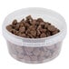 A 12 oz. clear plastic deli container full of chocolate chips.