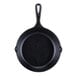 A black Lodge mini cast iron skillet with a handle.