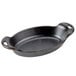 A black Lodge mini cast iron oval casserole dish with handles.