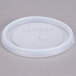 A white plastic Cambro lid with a straw slot and cross on it.