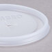 A white plastic Cambro lid with a straw slot.