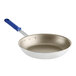 A close-up of a Vollrath Wear-Ever aluminum non-stick fry pan with a blue Cool Handle.