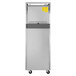 A stainless steel Turbo Air M3 half door reach-in freezer with yellow stickers on it.