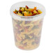 A clear plastic deli container filled with pasta.