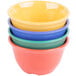 A stack of colorful GET Diamond Mardi Gras melamine bouillon bowls.