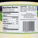 The label on a glass jar of grape jelly with nutrition facts.