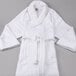 A white Oxford Velour bath robe with a shawl collar and a belt.