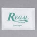 A white Regal Cane Sugar packet with green text.