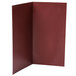 A burgundy Menu Solutions wine list cover with a white rectangular paper inside.