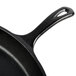 A Lodge pre-seasoned cast iron skillet with a handle.