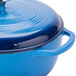 A Caribbean blue Lodge enameled cast iron dutch oven with a lid.