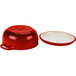A red Lodge enameled cast iron Dutch oven with a white lid