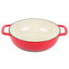 A red enameled cast iron Dutch oven with white interior and two handles.