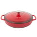 A Lodge Island Spice Red enameled cast iron casserole dish with a lid.