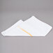 A folded white Chef Revival bar towel with a yellow stripe.