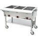 An APW Wyott stainless steel sealed well steam table with three pans on a counter.