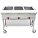 An APW Wyott stainless steel portable steam table with a sealed well holding three trays of food.