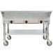 A stainless steel APW Wyott portable steam table on wheels.