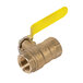 A close-up of a brass ball valve with a yellow handle on a pipe.