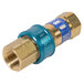 A close-up of a Dormont brass gas connector with blue and gold threads.