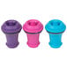 A group of Vacu Vin wine stoppers in assorted colors with black rings.