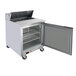 A Beverage-Air stainless steel refrigerated sandwich prep table with a door open.