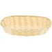 A natural rattan oblong basket with a handle.
