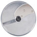 A Robot Coupe stainless steel metal disc with metal blades.