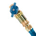 A close-up of a blue Dormont gas hose fitting with gold accents.