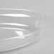 A clear plastic Fineline deep oval bowl.