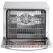 An open Avantco stainless steel countertop convection oven with a metal rack inside.