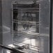 A stainless steel Avantco rack support inside a CO-28 convection oven.