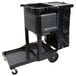 A black Rubbermaid janitor cart with a black bag on it.