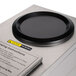 A close-up of an Avantco warming plate on a counter.