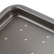 A Nemco coated tray liner with holes in it.