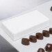 A white box of chocolates.