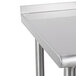A stainless steel Advance Tabco equipment filler table.