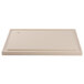 A white rectangular polyethylene carving board with a hole in the middle.