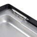 A silver metal tray with a metal hinge.