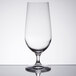 A Stolzle New York clear wine goblet with a stem on a table.
