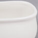 An American Metalcraft white porcelain sugar packet holder with a lid.