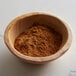 A bowl of Regal ground cinnamon powder.