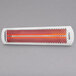 A white Bromic Heating Tungsten Smart-Heat electric patio heater with red accents on a gray metal surface.