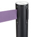 A black Aarco crowd control stanchion with dual purple retractable belts.
